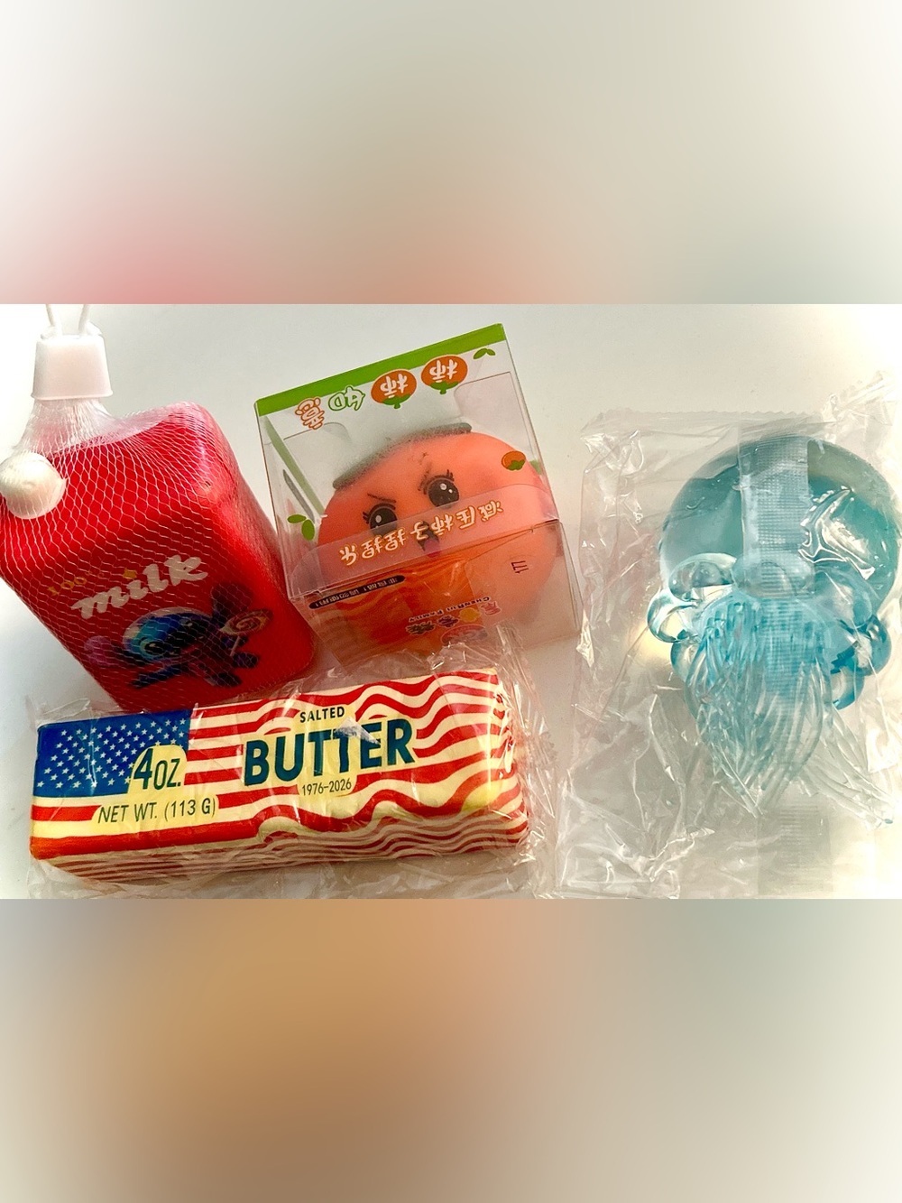 4-piece squishy set, jellyfish squishy toy, slow rise milk, USA butter, tomato
